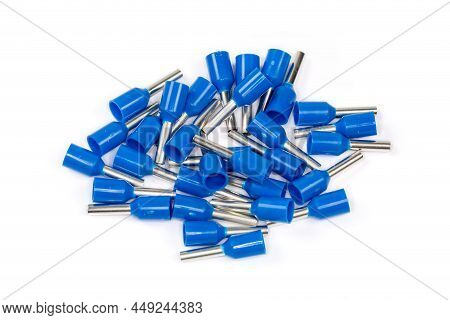 Small Heap Of Blue Insulated Crimp Round Terminals For Electric Wire Ends On A White Background, Clo