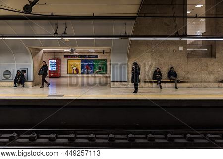 Lisbon, Portugal - 12 28 2018: People Waiting At The Metro Railway Platform In Underground Station A