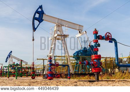 Oil Pumping Chair In The Fields Of Siberia. Oil And Gas Industry In Russia.