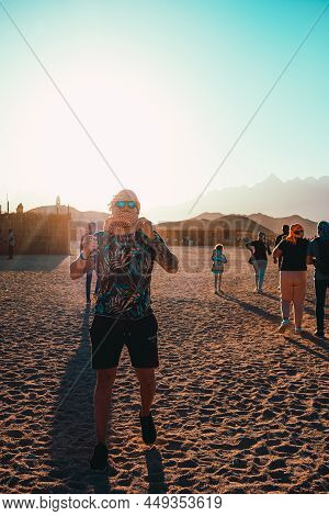Hurghada Egypt January 2022 Man With Sunglasses And A Scarf Standing In The Middle Of The Desert Nea