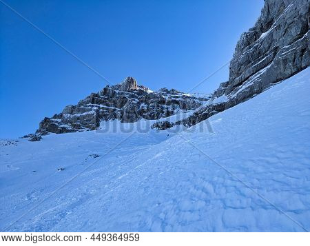 Deep Snow Descent With The Skis From The Mutteristock. North Descent With Avalanche Risk. Beautiful 