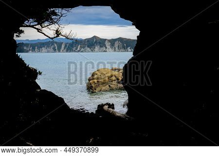 Blue Water Of Tolaga Bay Through Hole In The Wall Tourist Destination And Landmark On East Coast New