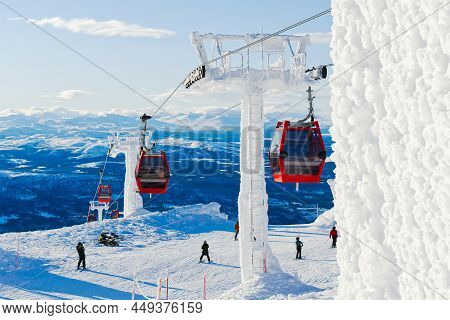 Red Cable Car In A Ski Resort In The Alps. Red Gondola Funicular In A Ski Resort, Sweden, Frosty Sun