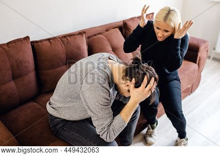 Tired Frustrated Caucasian Husband Ignoring Angry Despot Wife Arguing Blaming Upset Man Of Problems,