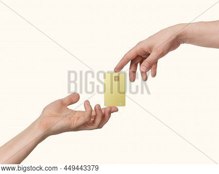 Hands Keep Gold Bank Card In Spotlight, Isolated On Beige Light Background