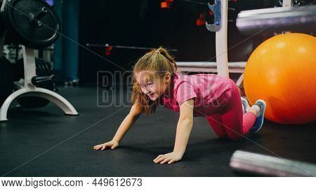 Fit Athletic Baby Girl Work Out Stretching, Doing Her Fitness Ex