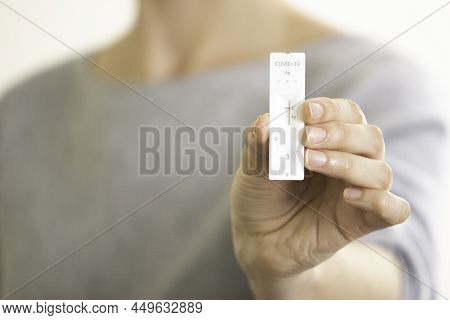 Woman Showing Covid-19 Rapid Antigen Diagnostic Test Device. Close-up Of Womans Hand Showing Negativ