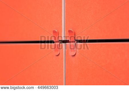 Red Square Ventilated Ceramic Panels Installed On The Facade Of The Building. Special Fastener For F