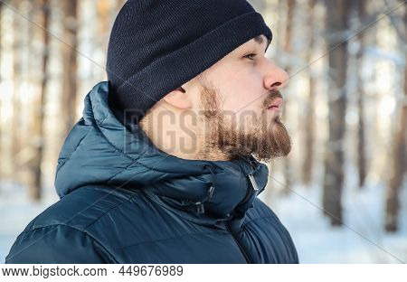 Face Of A Young Man With Messy And Untrimmed Beard And Moustache Close-up. Selective Focus. Outdoors