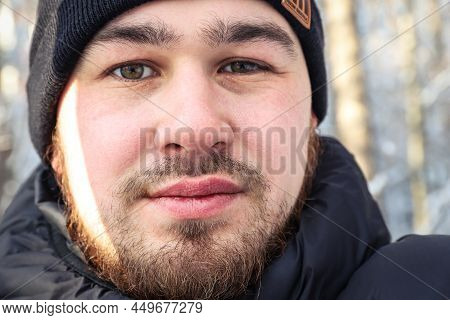 Face Of A Young Man With Messy And Untrimmed Beard And Moustache Close-up. Selective Focus. Outdoors