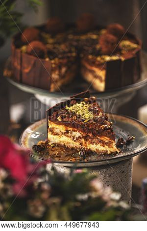 Slice Of Tiramisu Cake With Truffle And Coffee Beans Decoration