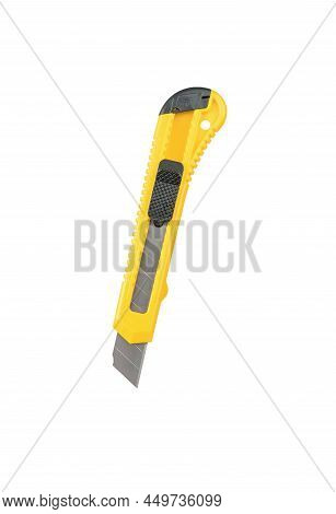 Unfolded Yellow Stationery Knife Isolated On A White Background. Stationery.