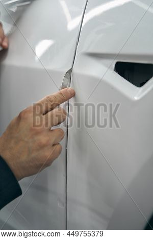 Hand Removing Excess Ppf On Car Body Panel