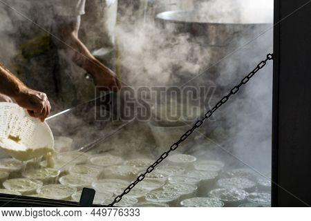 Process Of Making Fresh White Soft Ricotta Whey Cheese On Small Cheese Farm In Parma, Italy