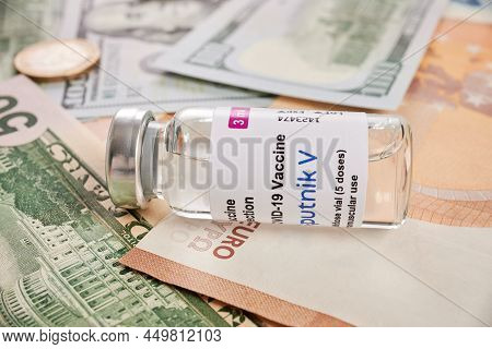 Krasnoyarsk, Russia - February 04, 2022: Sputnik-v Vaccine Vial - Photo On Cash Bank Notes. Sputnik 