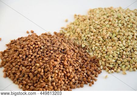 Cereals Of Buckwheat And Green Unboiled Buckwheat On A White Background