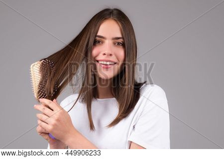 Young Beautiful Woman Combing Hair. Hair Care. Beautiful Brunette Woman Hairbrushing Hair With Hairb