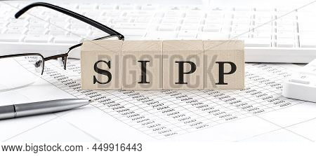 Sipp Written On Wooden Cube With Keyboard , Calculator, Chart,glasses.business