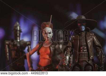 FEB 23 2022: scene from Star Wars The Cone Wars, bounty hunters Cad Bane and Aurra Sing with 2 assassin IG droids - Hasbro action figure