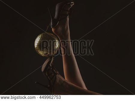 Celebrating. Disco Ball On High Heels. Party Legs. Holidays Event. Woman Heels With Gold Disco Ball.