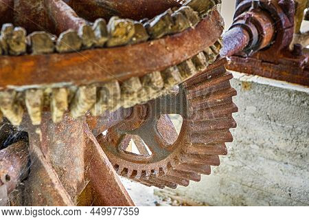 Old Wood And Metal Cog Wheels Connected Together In One Design Mechanism Used Mills Grain Grinding.