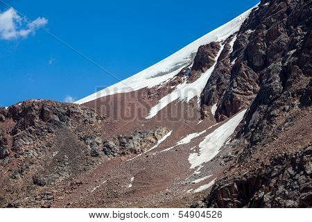 Snow slope of red mountain. Tien Shan
