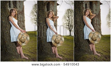 Pretty young woman posing in front of the farm. Very attractive blonde girl with white short dress