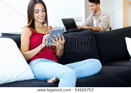 Young Couple Working At Home