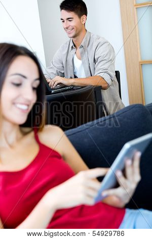 Young Couple Working At Home