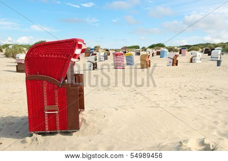 Typical striped chairs on German Borkum at the beach
