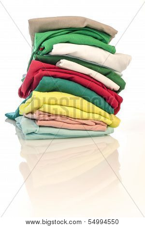 Pile of colorfull shirts isolated