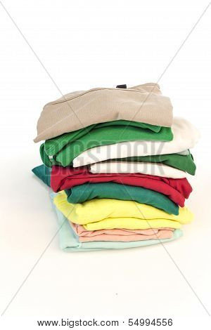 Pile of colorfull shirts isolated