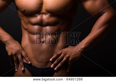 closeup of muscular african man 6 packs