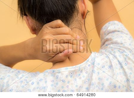 Young Woman Having Pain In The Back And Neck