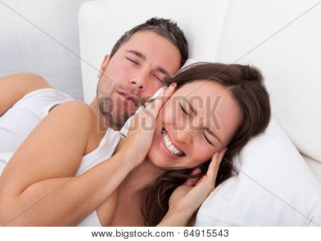 Woman Disturbed With Man Snoring