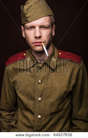 Russian soldier smoking cigarette