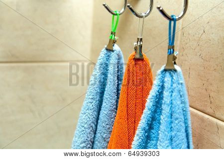 Three Towels Hanging On A Hook