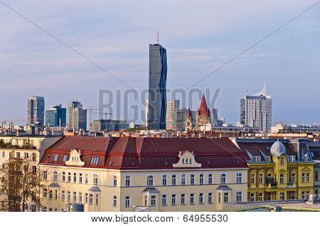 Vienna cityscape at sunset, contrast between modern skycrapers and old style buildings