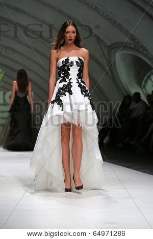 ZAGREB, CROATIA - MAY 09: Fashion model wearing clothes designed by Avaro Figlio on the Zagreb Fashion Week on May 09, 2014 in Zagreb, Croatia.