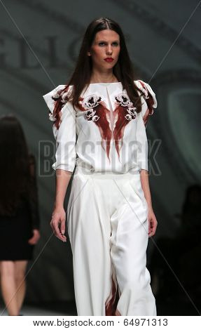 ZAGREB, CROATIA - MAY 09: Fashion model wearing clothes designed by Avaro Figlio on the Zagreb Fashion Week on May 09, 2014 in Zagreb, Croatia.