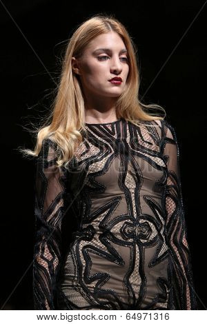 ZAGREB, CROATIA - MAY 09: Fashion model wearing clothes designed by Avaro Figlio on the Zagreb Fashion Week on May 09, 2014 in Zagreb, Croatia.