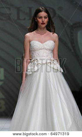 ZAGREB, CROATIA - MAY 09: Fashion model wearing clothes designed by Avaro Figlio on the Zagreb Fashion Week on May 09, 2014 in Zagreb, Croatia.