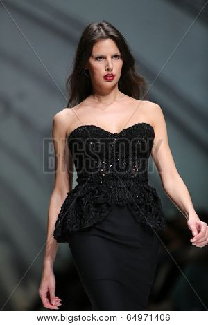 ZAGREB, CROATIA - MAY 09: Fashion model wearing clothes designed by Avaro Figlio on the Zagreb Fashion Week on May 09, 2014 in Zagreb, Croatia.