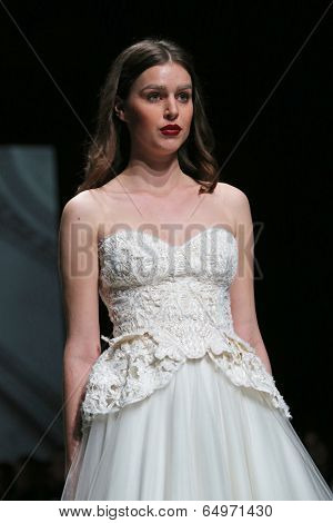 ZAGREB, CROATIA - MAY 09: Fashion model wearing clothes designed by Avaro Figlio on the Zagreb Fashion Week on May 09, 2014 in Zagreb, Croatia.
