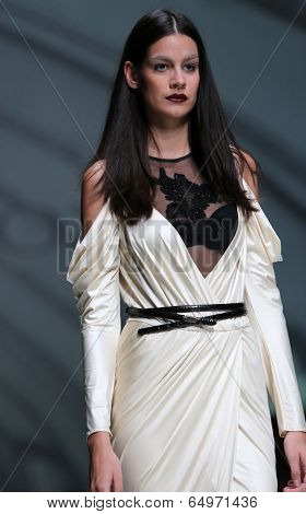 ZAGREB, CROATIA - MAY 09: Fashion model wearing clothes designed by Avaro Figlio on the Zagreb Fashion Week on May 09, 2014 in Zagreb, Croatia.