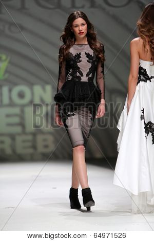 ZAGREB, CROATIA - MAY 09: Fashion model wearing clothes designed by Avaro Figlio on the Zagreb Fashion Week on May 09, 2014 in Zagreb, Croatia.
