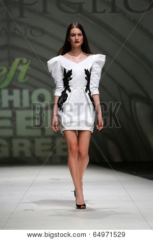 ZAGREB, CROATIA - MAY 09: Fashion model wearing clothes designed by Avaro Figlio on the Zagreb Fashion Week on May 09, 2014 in Zagreb, Croatia.