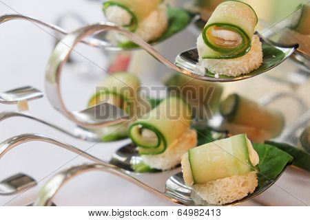 the image of an appetizers  on party spoons