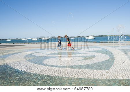 Children in water feature.