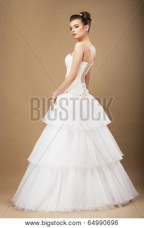 Full Length Portrait Of Graceful Bide In White Wedding Dress